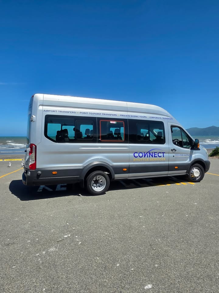 Ford Transit Bus - Side profile showing professional signwriting